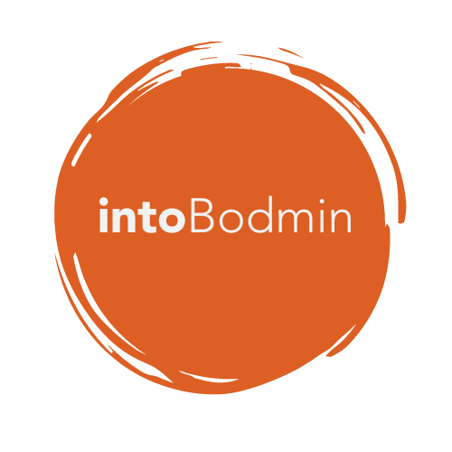 intoBodmin circular logo in burnt orange on a white background