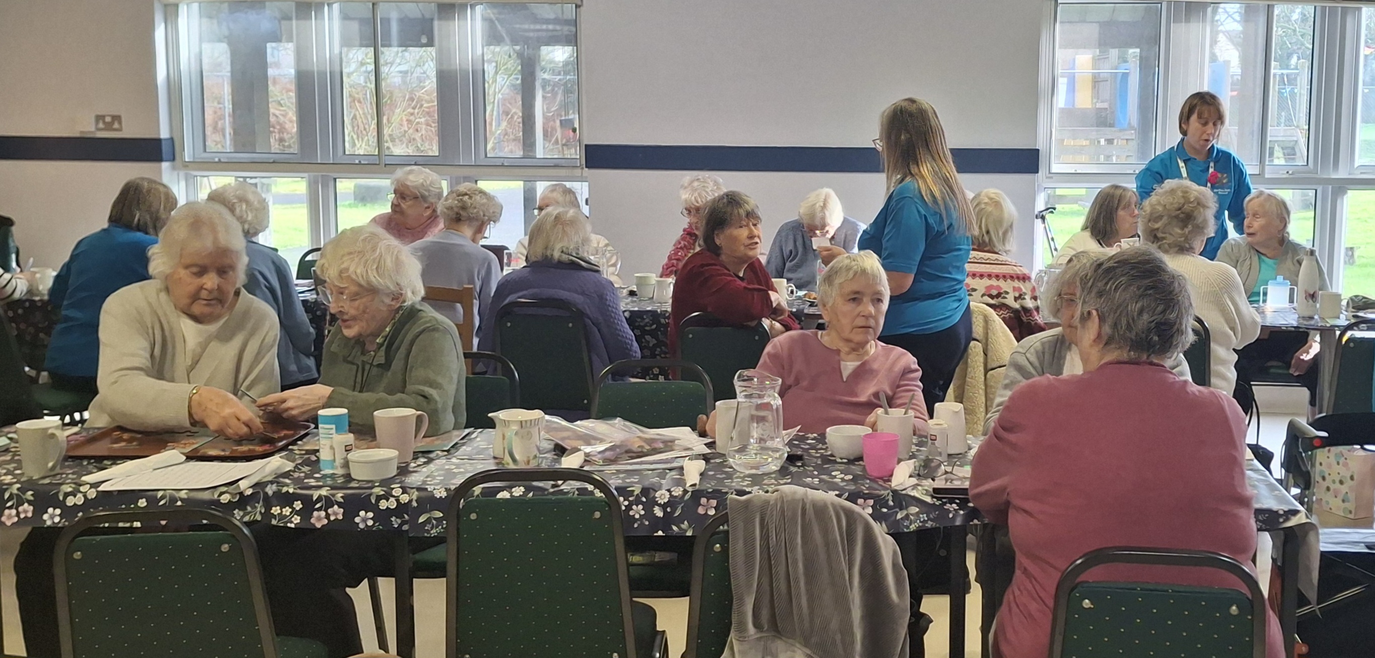 group of people at wellbeing cafe