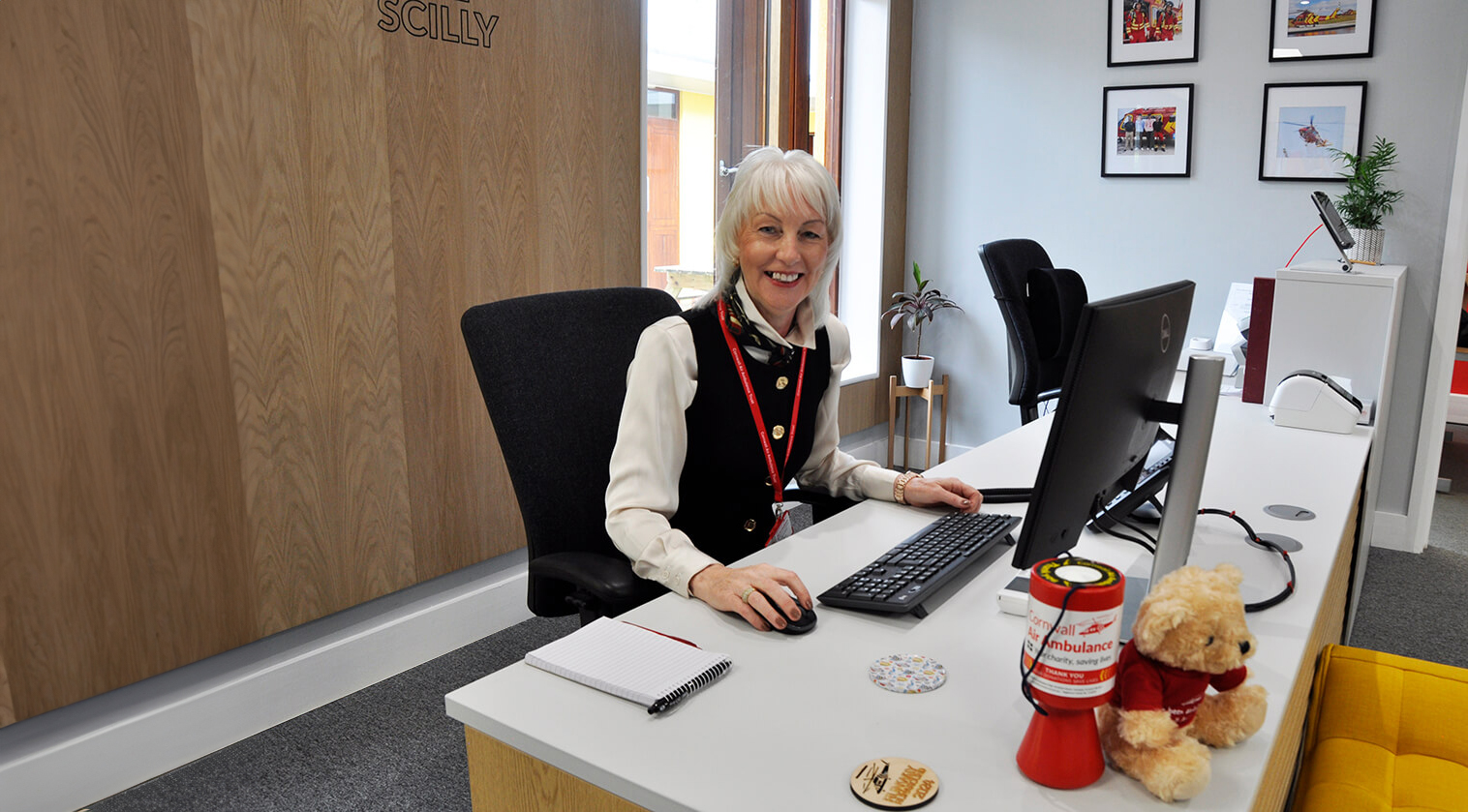 Reception volunteer at desk 