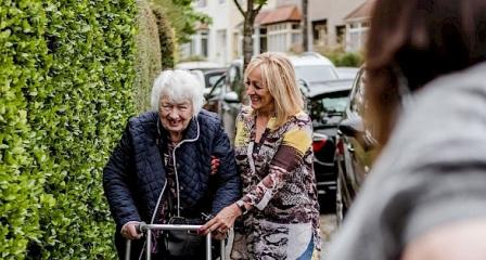 Volunteer driver helping an older person