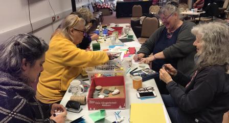 People engaged in craft activity