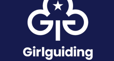 Girlguiding Cornwall logo, white trefoil on navy blue background.