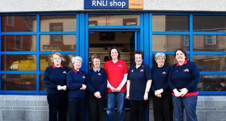 Picture of volunteers outside a RNLI shop. 