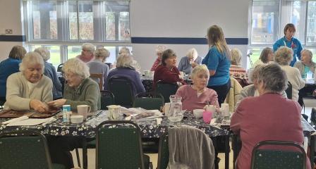group of people at wellbeing cafe