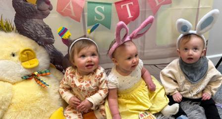group of small children with easter banner