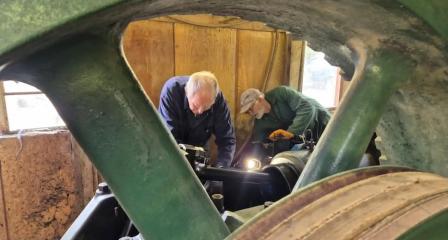 Image shows two members working on the Ruston Hornsby engine at Nance saw mills